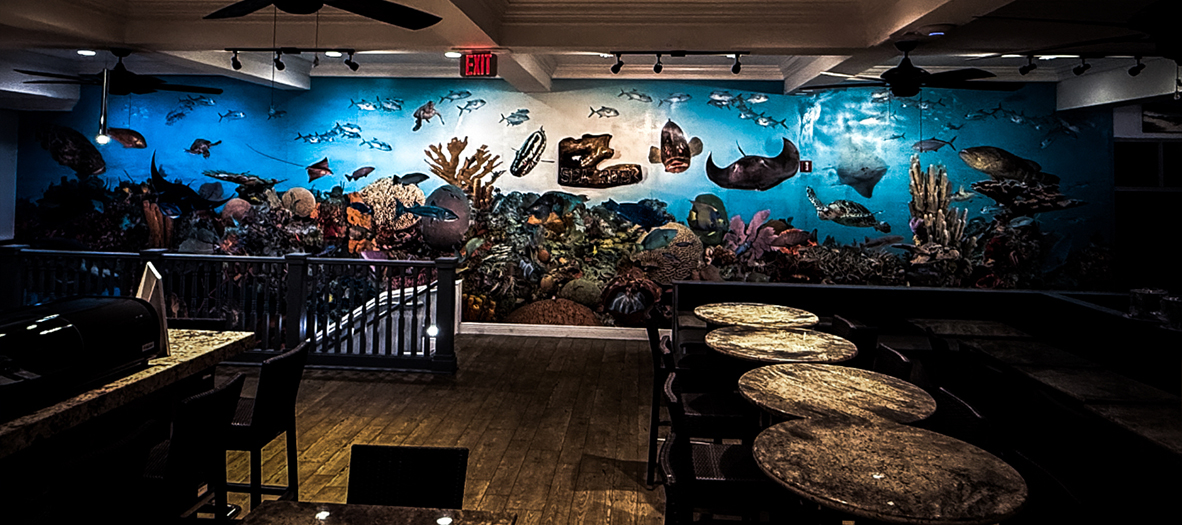 The full Reef Mural - Cayman's coral garden, turtle and stingray across the dining-room wall