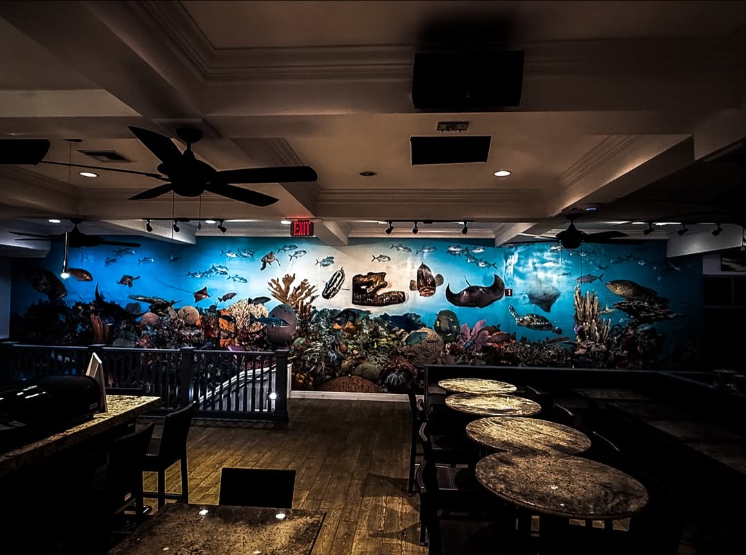 The Reef Mural at SeaRock - Cayman's underwater world across a full candlelit wall