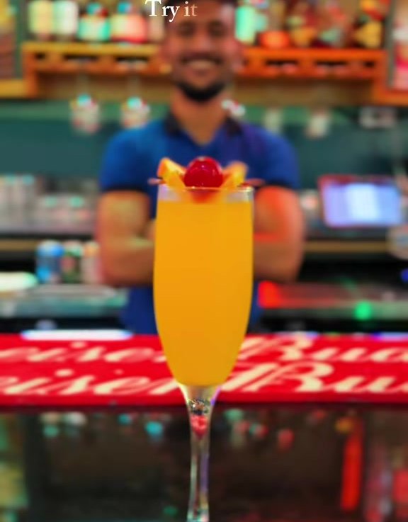 Sunset Spritz - Sparkling wine, guava, bitters and soda - timed for the harbour light - served at SeaRock Bar & Restaurant, George Town, Grand Cayman